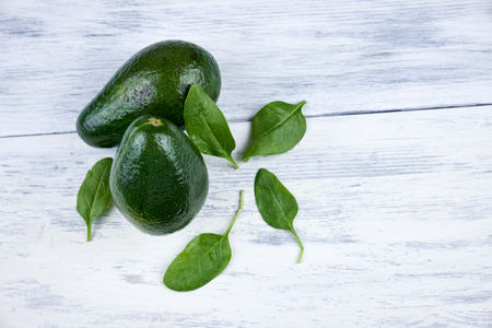Avocado on white wooden backgroundの写真素材