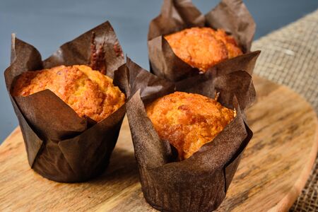 cupcakes on a wooden Board and burlap on a gray background. Rustic styleの写真素材