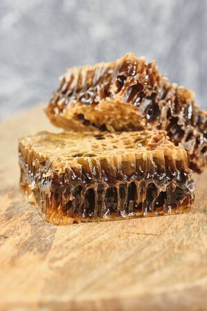 honeycomb with honey on wooden Board,の写真素材