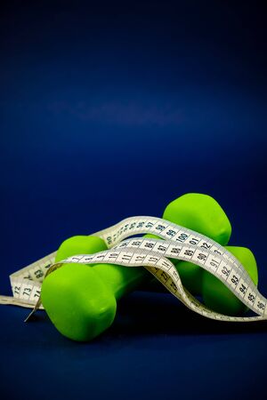 Green dumbbells lie on top of each otherの写真素材