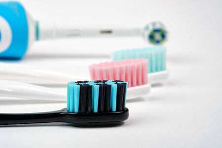 Colorful toothbrushes close-up on a white background. Oral hygiene.の写真素材