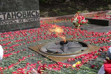 PYATIGORSK, RUSSIA - MAY 9 2014  Day of Victory in WWII  Flowers at the Eternal Flameのeditorial素材
