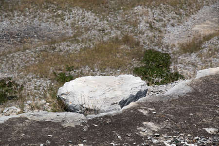Broken away white stone on the edge of the cliff. Russia, Lysaya Mountain areaの写真素材