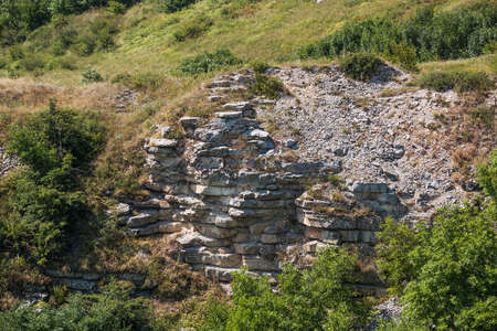Naked layers of the crust on the way to the top of Lisaya Mountain, Russiaの写真素材