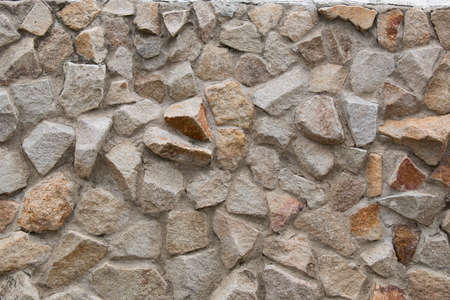 Texture the wall, lined with natural stone, backgroundの写真素材