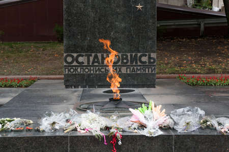PYATIGORSK, RUSSIA - AUGUST 11, 2014: Flowers on Eternal Flame (memorial to the lost heroes of the Second World War)のeditorial素材