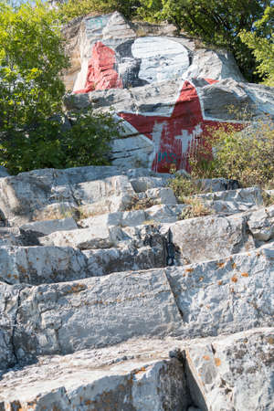 PYATIGORSK, RUSSIA - AUGUST 15, 2014: Lenin's portrait soiled by paint and inscriptions on the mountain Mashuk in Pyatigorskのeditorial素材