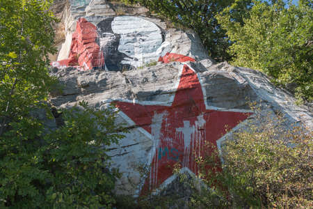 PYATIGORSK, RUSSIA - AUGUST 15, 2014: Lenin's portrait soiled by paint and inscriptions on the mountain Mashuk in Pyatigorskのeditorial素材