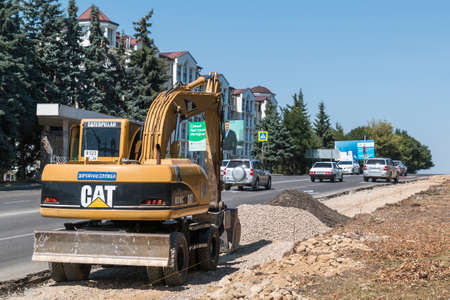 PYATIGORSK, RUSSIA - AUGUST 15, 2014: Excavator. Work to expand the Kalinin Prospektのeditorial素材