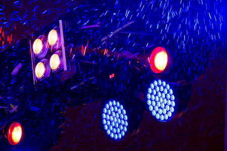 Traces of snowflakes flying in the spotlight