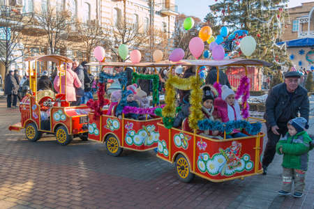 KISLOVODSK, RUSSIA - JANUARY 2, 2015: Children ride the rides, small train at the city Christmas tree on the Kurortny Boulevardのeditorial素材