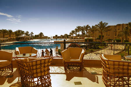 SHARM EL-SHEIKH, EGYPT - NOVEMBER 30, 2014: tables and chairs on the terrace of the hotel Grand Oasis Resort in hot weatherのeditorial素材