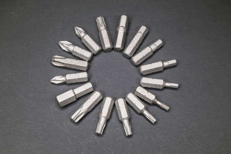 Replaceable bits for a screwdriver in the form of a circle on a dark background