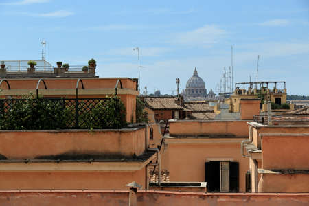 Rome, Italy - August 17, 2015: View on roof of buildings and dome of St. Peter's Basilica italian: Basilica di San Pietro from Piazza del Quirinale. Focus on domeのeditorial素材