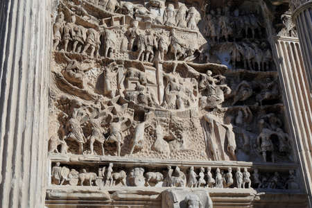 Carved in stone figures of wall of Septimius Severus Arch in Rome, Italyの写真素材