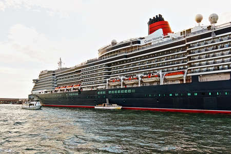 Venice, Italy - August 21, 2015: Cruise Ship MS Queen Victoria and boats in Veniceのeditorial素材