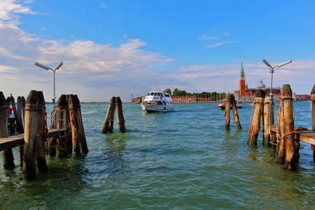 Venice, Italy - August 21, 2015: Arrival to berth a motor boat with passengers in the morning sun against the Chiesa di San Giorgio Maggioreのeditorial素材