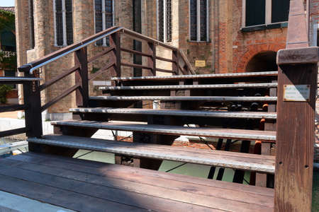 Venice, Italy - August 21, 2015: Wooden bridge over the canal in Veniceのeditorial素材