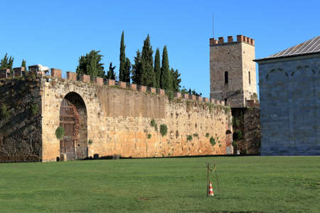View to city walls, erected in 1156 by Consul Cocco Griffi. Pisa, Italy. Tower Torre di Santa Maria.のeditorial素材