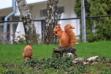 Pyatigorsk, Russia - April 1, 2017: Sculpture of a red squirrel sitting on a stump. Territory of the sanatorium Lermontov in Pyatigorsk. Stavropol Regionのeditorial素材