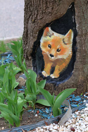 Pyatigorsk, Russia - April 1, 2017: Picture of a red fox on a tree trunkのeditorial素材