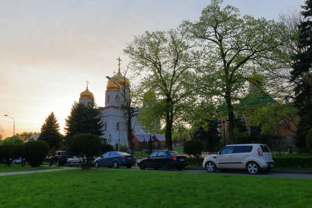 Pyatigorsk, Russia - April 29, 2017: Parked cars near the Cathedral of Christ the Savior at sunset....