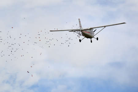 Pyatigorsk, Russia - May 9, 2017: Light single-engine Cessna plane flushes leaflets over the Pyatigorsk city. Parade in honor of the Victory Day in the Second World Warのeditorial素材