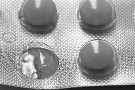 White medicine pills in blister pack. The concept of medicine or drug abuseの写真素材