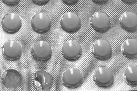 White medicine pills in blister pack. The concept of medicine or drug abuseの写真素材