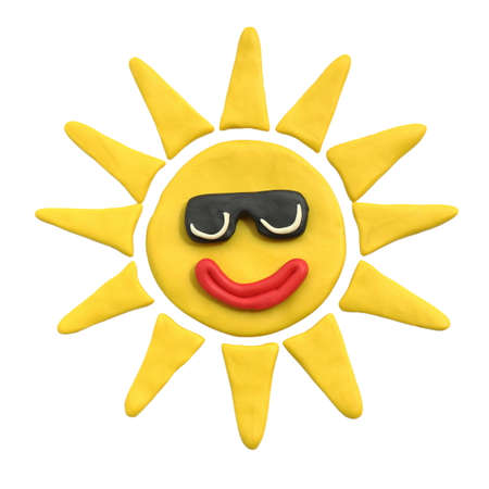 Yellow sun with smile in black sunglasses. Plasticine. Isolated on a white background. The concept of children's creativity or sunny weatherの写真素材