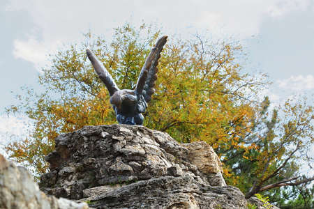 The bronze sculpture of an eagle fighting a snake on a Mashuk mountain. Pyatigorsk, Russia. This is a official symbol of the Caucasian Mineral Waters. This monument was opened in 1901の写真素材
