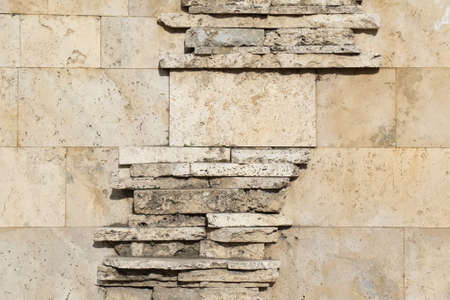 The wall of blocks from yellow shell rock. Backgroundの写真素材