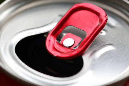 Aluminum can with red pull ring close-up. Selective focusの写真素材