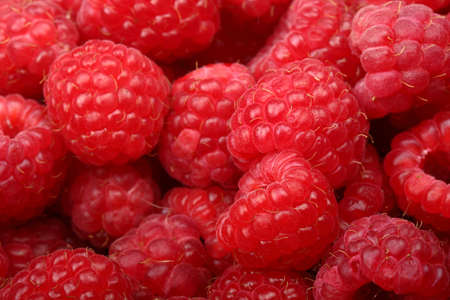 Juicy and fresh ripe raspberries close-up. Natural background. Food ingredients