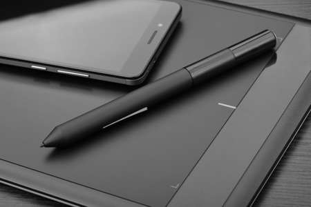 Smartphone and graphic tablet (also known as a pen tablet or digital drawing tablet) with a special...