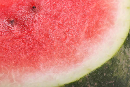 Slice of an red ripe watermelon close-up. Background