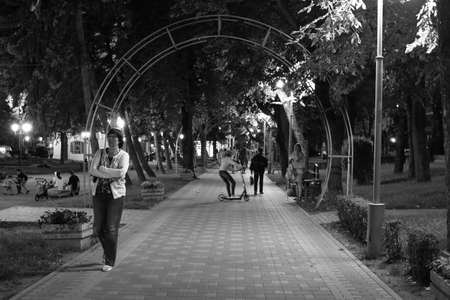Pyatigorsk, Russia - August 13, 2018: Unknown people walk through the night Tsvetnik Park in...