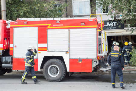 Firefighters training, foreground is drop of water springer, Selective focus. Zaporozhye, Ukraine,...