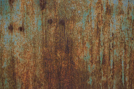 Grungy brushed yellow metal brass plate with screws rusty old metal texture. Blank for background,...