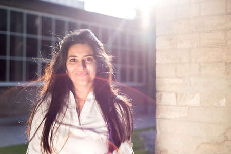 Beautiful Bengali, Indian woman smiling at the camera. Vintage style image processing.の写真素材