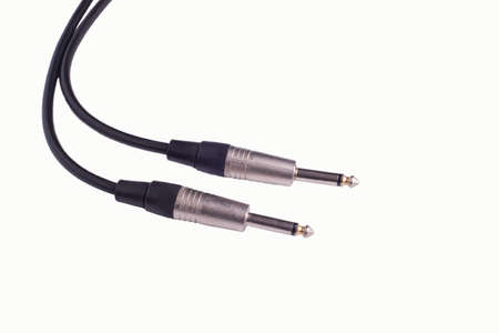 Guitar audio jack with black cable isolated on white background guitar jack cable, close-up,...