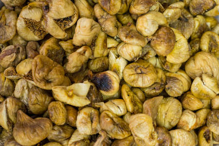 dried fig fruit background top view texture of figs. Dried fruits wholesome healthy natural vegetarian food.の写真素材