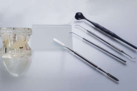 top view, medical dental instruments, on a sterile subject table of a dentist doctor. Near the dummy...