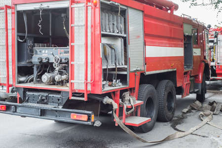 Engine red fire truck, the general plan. The work of the fire department at the scene. Putting out a...
