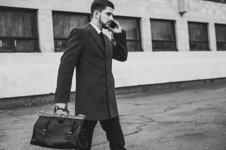 portrait of a young guy thirty years old. Businessman in a business style of clothing. Rides in the...