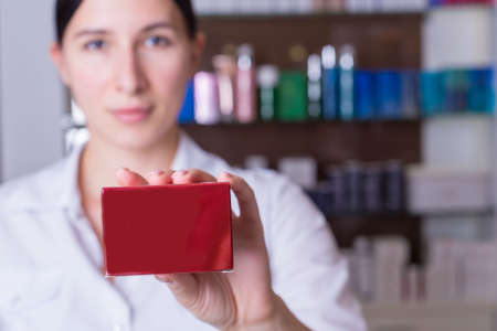 Closeup of a defocused girl, a cosmetologist, a specialist in the sale of cosmetics for body care,...