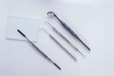 top view, medical dental instruments, on a sterile subject table of a dentist doctor. Near the dummy...