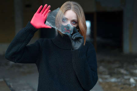 beauty portrait of a beautiful girl in a black mask with rhinestones, cool designer makeup. The girl...