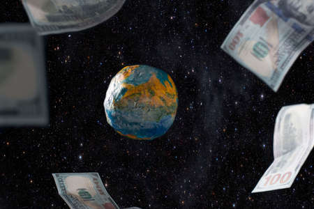 The concept of levitating dollar bills around the layout of the planet Earth, against the background of space. Money rules the world. Around the planet are circulating dollar bills. The financial upheaval. Monetary world system. Creative concept with money and planet earth.の写真素材