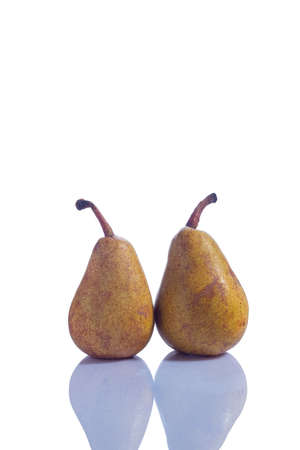 a pair of ripe yellow pears, isolated fruits on a white background Juicy fresh pears isolated on white backgroundの写真素材